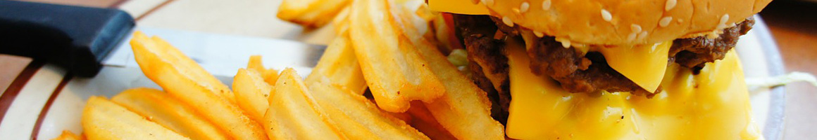 Eating Burger at Wolf's Hamburgers restaurant in Houston, TX.